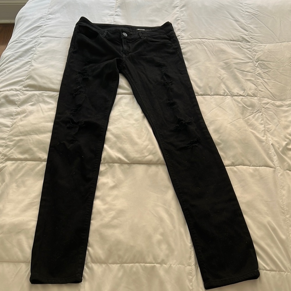 Black Orchid Skinny Jean in black with rips in the legs size 27